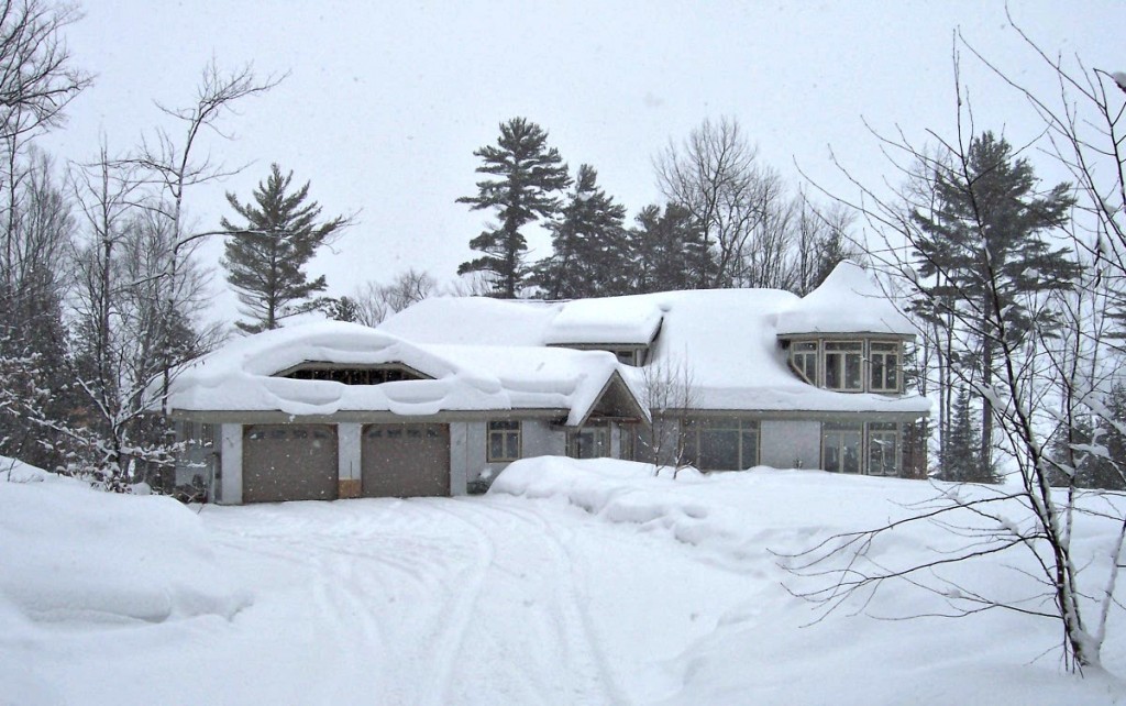 Our Parry Sound destination--Mom and Dad's house under a deep blanket of snow, with clouds above promising still more.